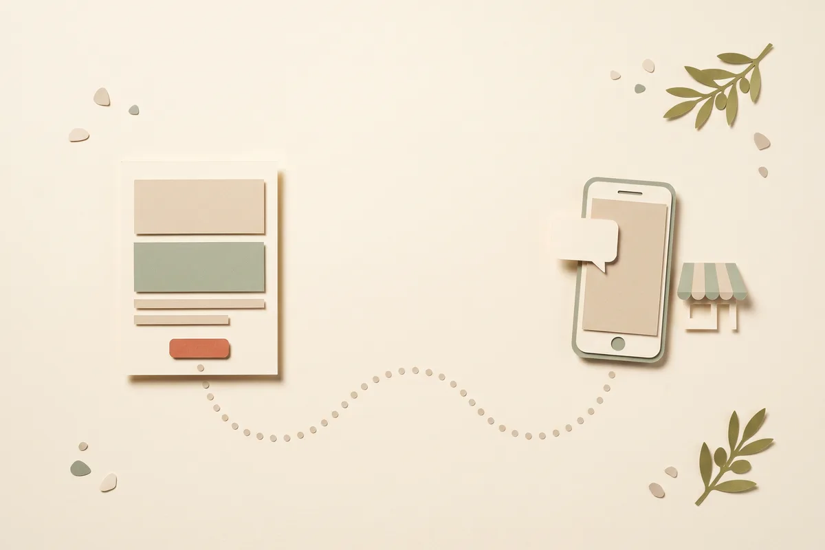 Paper-craft illustration of a single simple page card with a terracotta button, joined by a dotted path to a paper smartphone showing a chat bubble, beside a small shop awning
