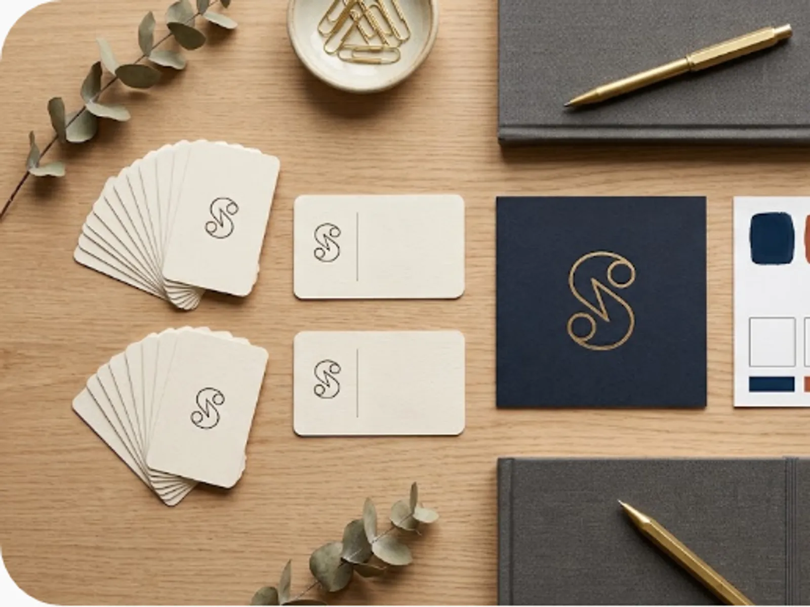 brand identity mockup with business cards and a colour palette