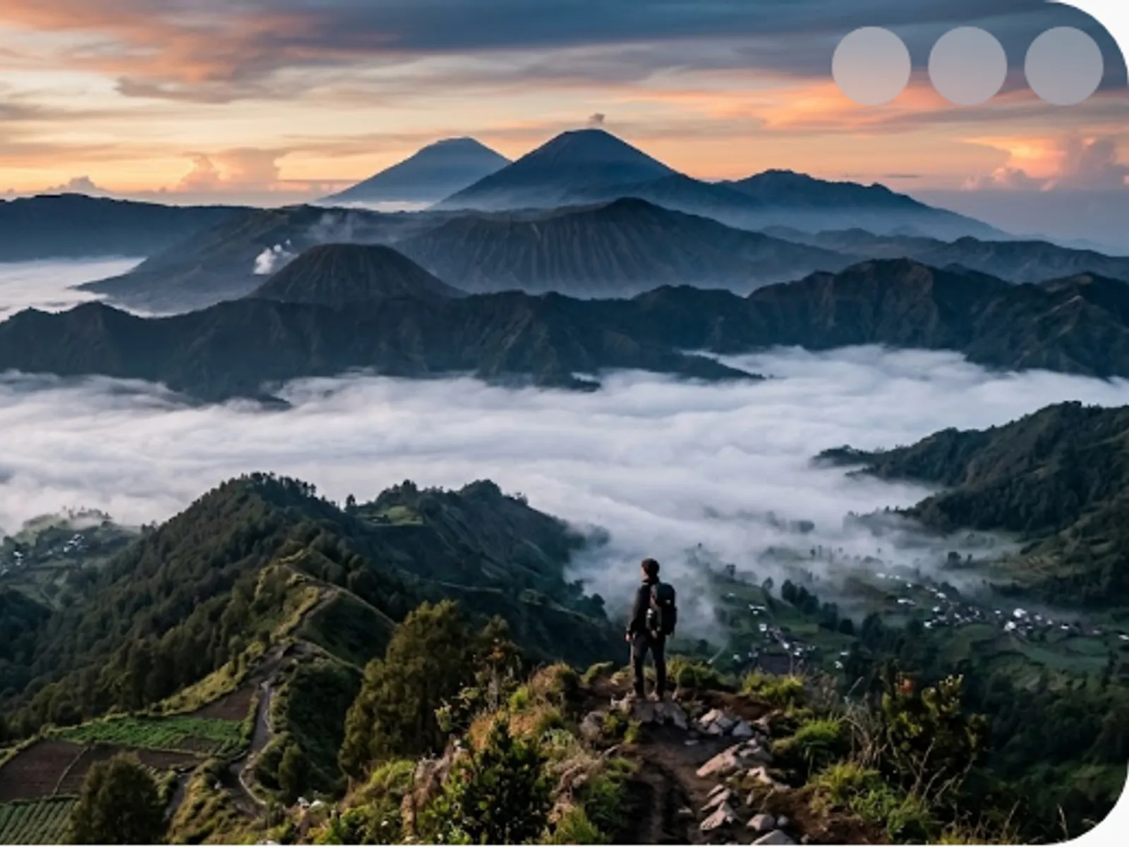 misty layered mountain peaks at dawn
